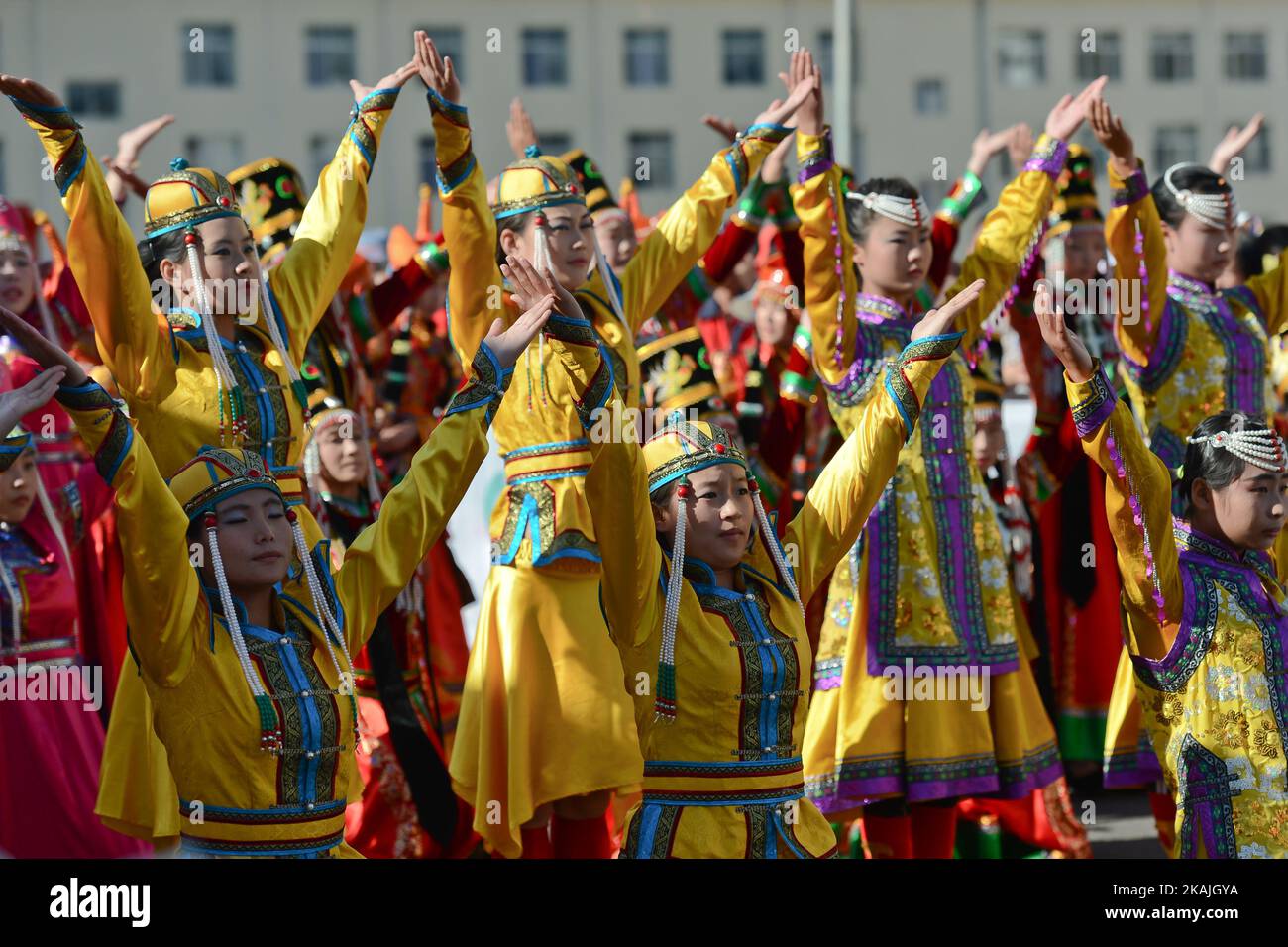 Local girls in traditional costumes perform a dance during the opening ceremony of the second stage, 157.8 km Weichang-Fengning, of the 2016 Tour of China 1. The second stage of the Tour of China starts in Yudaokou, in Weichang county, located at the far northeastern Hebei province. The area has been historically home to Manchu soldiers.  The stage finishes in Fengning county, in front of Great Khan palace on north grassland of the country. On Saturday, 9 September 2016, in Fengning, China. *** Please Use Credit from Credit Field *** Stock Photo
