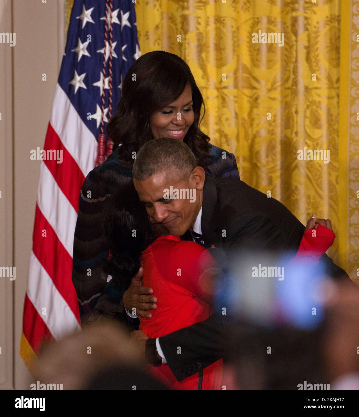 In  the East Room of the White House in Washington, DC, September 29, 2016, President Barack Obama hugs  Olympian Simone Biles, as First Lady Michelle Obama looks on. (Photo by Cheriss May/NurPhoto) *** Please Use Credit from Credit Field *** Stock Photo