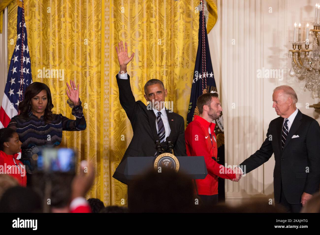 In  the East Room of the White House in Washington, DC, September 29, 2016, l-r, Simone Biles, First Lady Michelle Obama, and President Barack Obama, wave, as Josh Brunais, and VP Joe Biden, shake hands, at the end of the ceremony honoring the 2016 U.S. Olympic and Paralympic teams to the White House in Washington, DC, September 29, 2016. (Photo by Cheriss May/NurPhoto) *** Please Use Credit from Credit Field *** Stock Photo