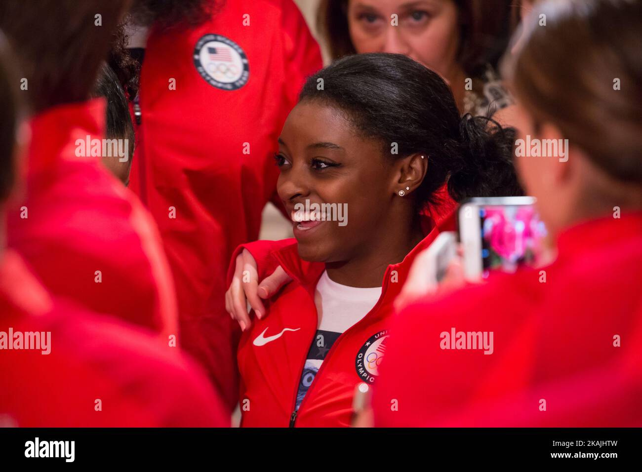 In  the East Room of the White House in Washington, DC, September 29, 2016, Simone Biles, a gymnast on the U.S. Women's gymnastics team, poses for pictures with other Olympians. (Photo by Cheriss May/NurPhoto) *** Please Use Credit from Credit Field *** Stock Photo