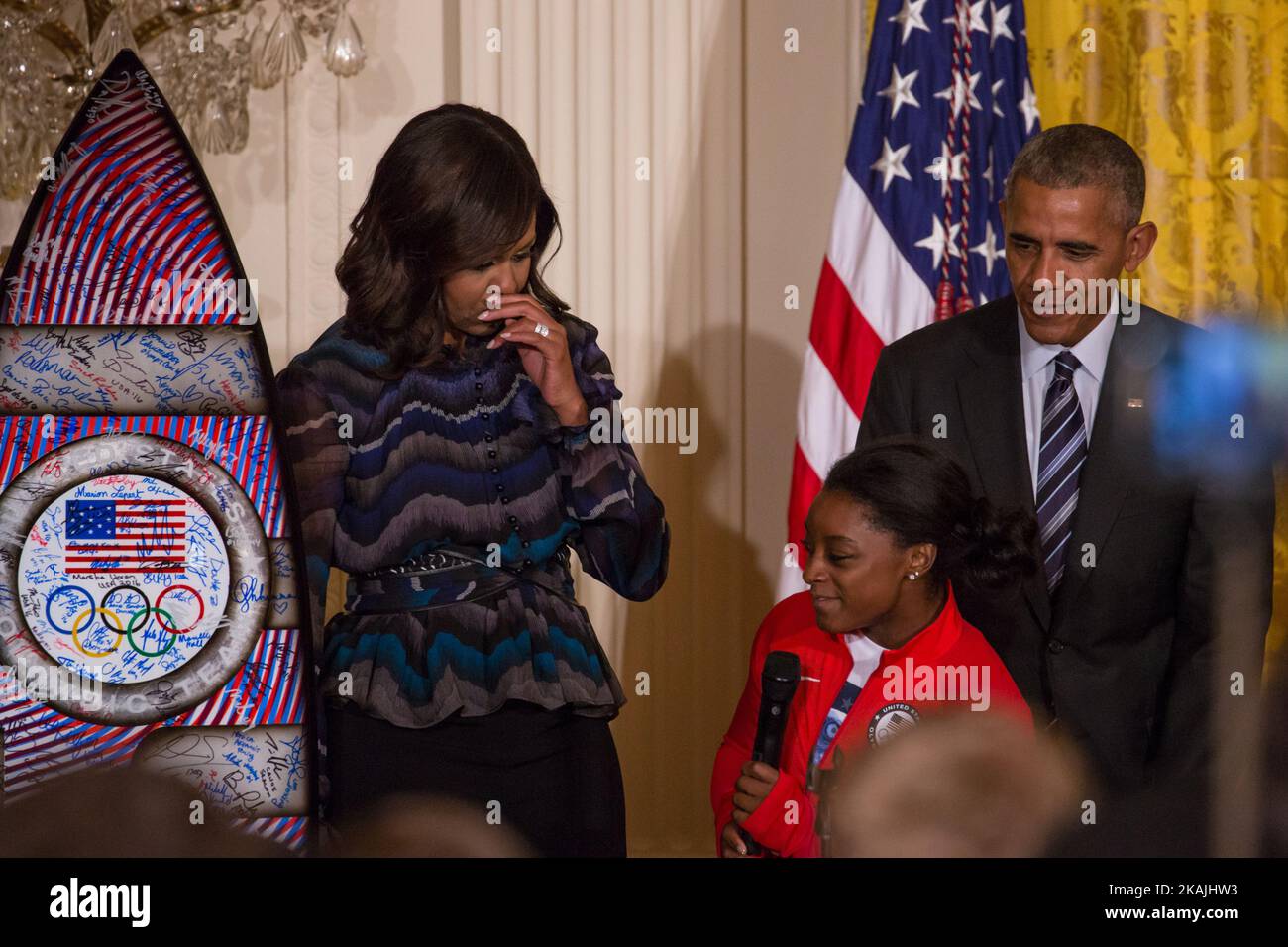 In  the East Room of the White House in Washington, DC, September 29, 2016, Simone Biles, a gymnast on the U.S. Women's gymnastics team, presents a custom surfboard to POTUS and FLOTUS, with signatures from U.S. Olympians who participated in the Rio Games. (Photo by Cheriss May/NurPhoto) *** Please Use Credit from Credit Field *** Stock Photo