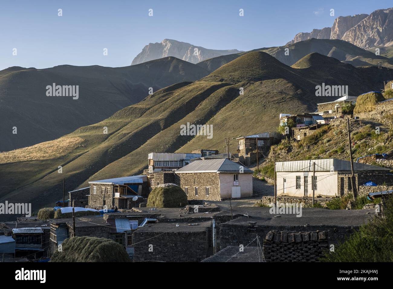 Houses on the top of Khinalig village, Quba region, Azerbaijan. Khinalig is an ancient village deep in the Caucasian mountains on the height of more than 2,300 meters above the sea level. Local people, called Kettid have preserved their traditional way of life. It can be seen even in the architecture. Khinalig people built their houses one over another. As a result, the roof of a building becames a yard for a higher one. Local men spend every sunset in such yards; they drink tea and look at the mountains. ( (Photo by Oleksandr Rupeta/NurPhoto)) *** Please Use Credit from Credit Field *** Stock Photo