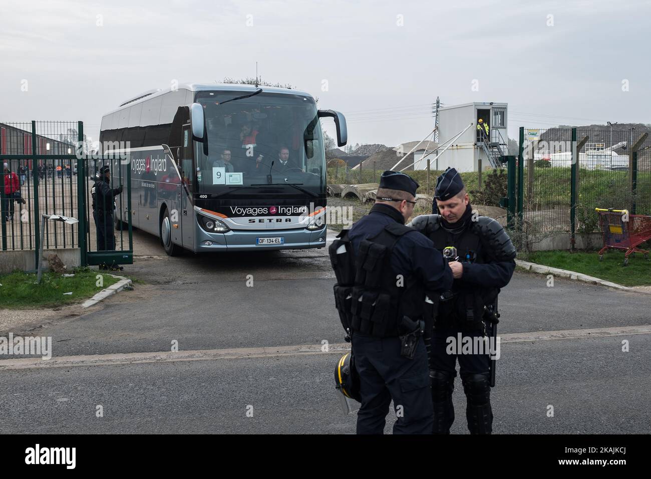 A Bus with Migrants leaves the Registration at the Calais Jungle. The refugee camp on the coast to the English Channel is to be cleared today. The approximately 8,000 refugees are distributed after the registration by busses to various reception centers in France. (Photo by Markus Heine/NurPhoto) *** Please Use Credit from Credit Field *** Stock Photo