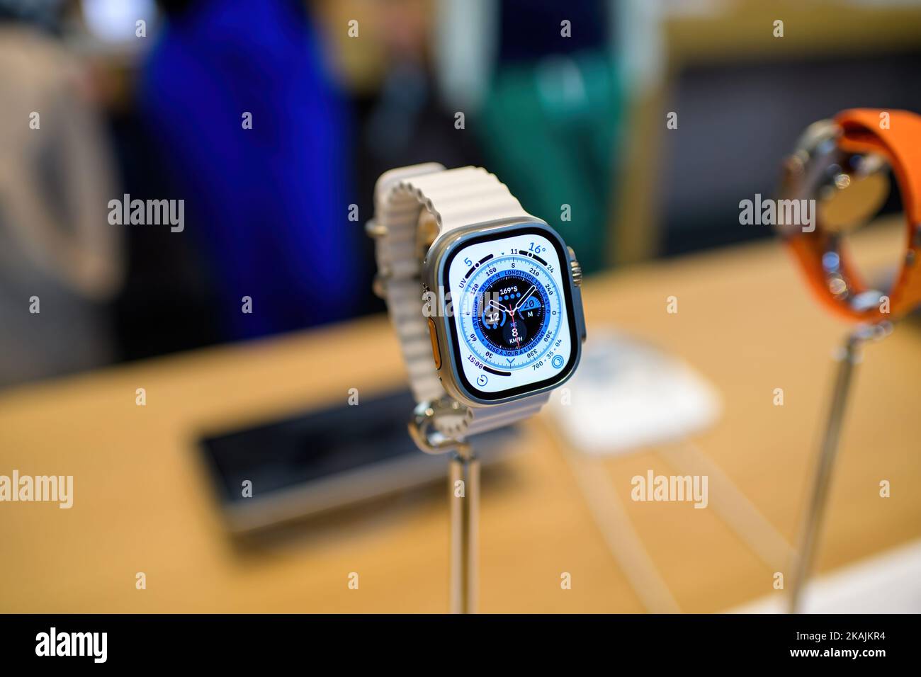 Paris, France - Oct 28, 2022: Presentation inside Apple store of the new wearable device Apple Watch Ultra - close-up of the new Wayfinder watch face Stock Photo