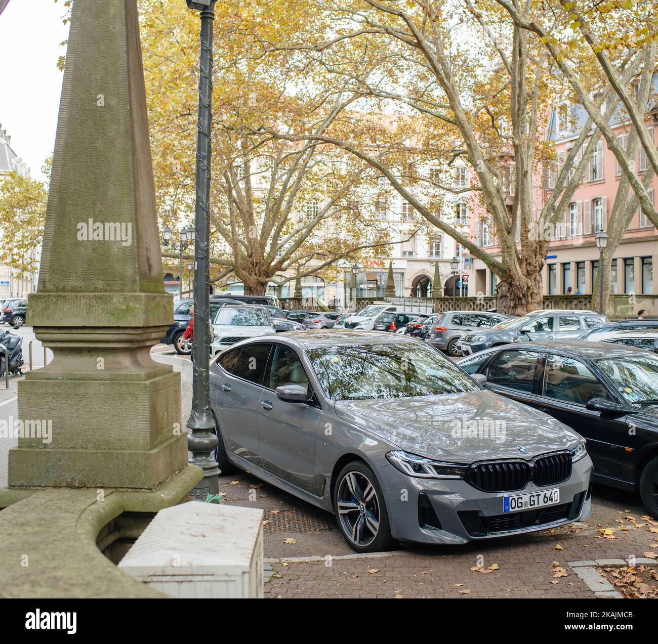Strasbourg, France - Oct 28, 2022: New luxury gray BMW m sport car parked in city center - large area with multiple luxury cars Stock Photo