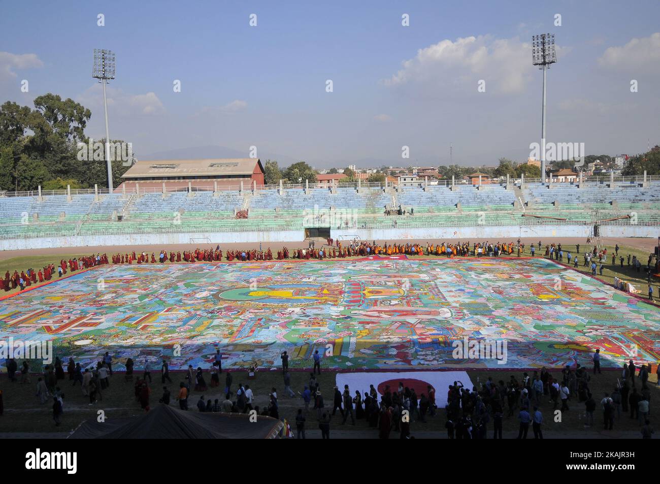 Nepalese Buddhist Kora Arounds World's largest Thangka Painting of 12