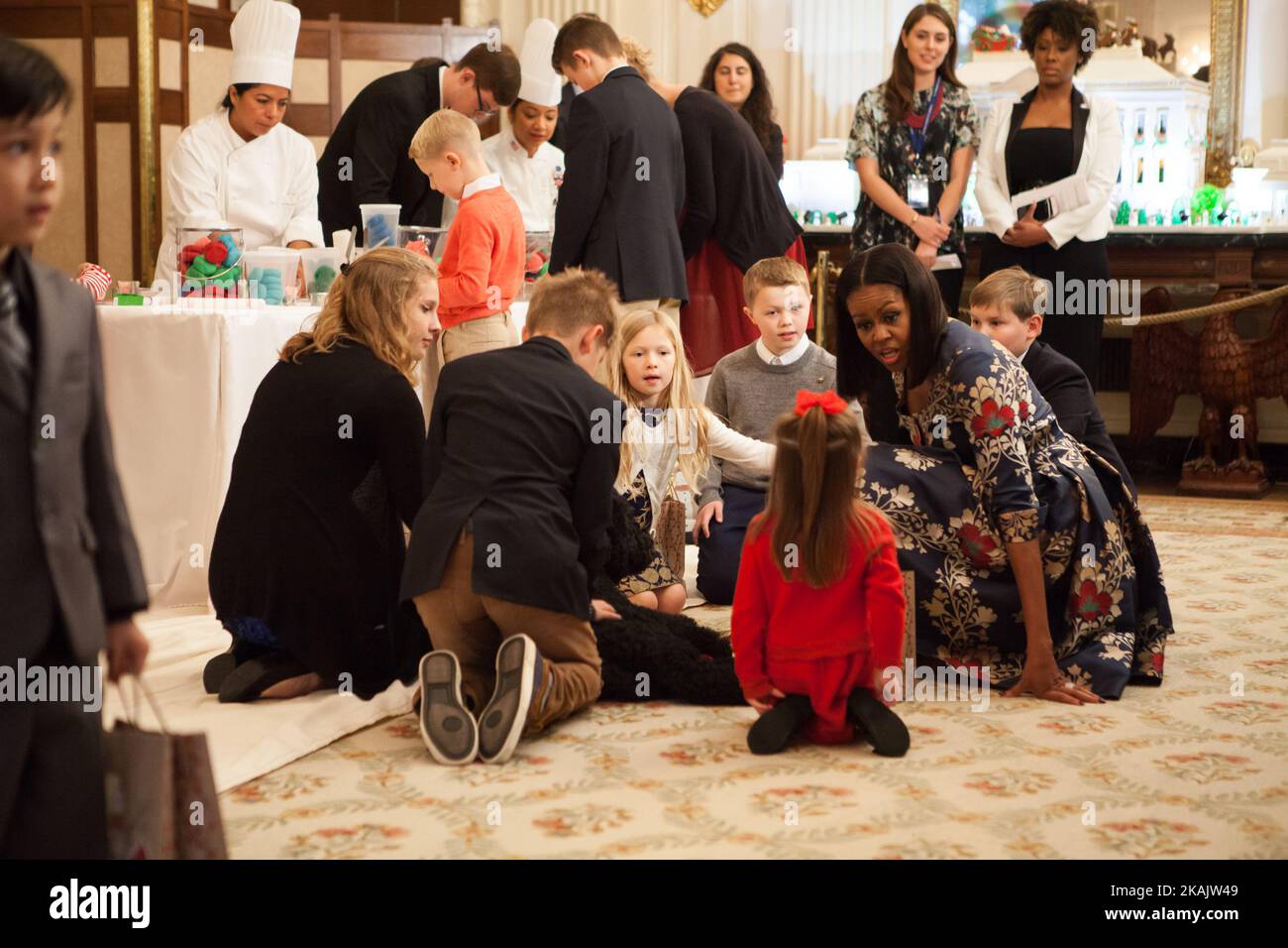 On Tuesday, November 29, in the State Dining Room of The White House, First Lady Michelle Obama with First Dogs, (l-r) Sunny, and Bo, were joined by White House Executive Chef Cris Comerford, White House Executive Pastry Chef Susan Morrison, and White House Chief Floral Designer Hedieh Ghaffarian who made holiday crafts and treats with the children of military families.(Photo by Cheriss May/NurPhoto) *** Please Use Credit from Credit Field *** Stock Photo