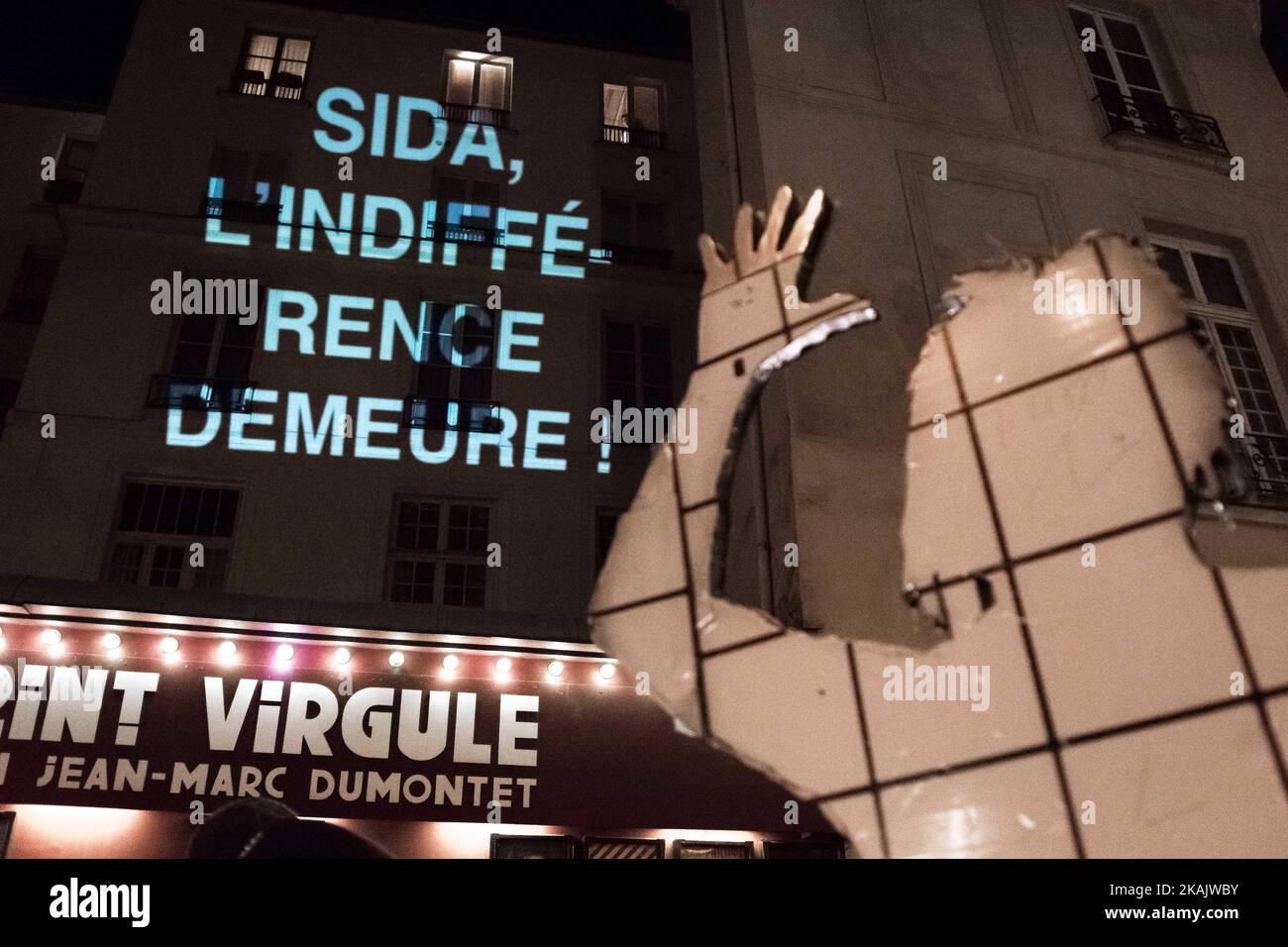 People gather for a demonstration on World AIDS Day in Paris on December 1, 2016. World AIDS Day is marked worldwide annually on December 1, to raise awareness of the global AIDS pandemic caused by the spread of HIV infection. (Photo by Julien Mattia/NurPhoto) *** Please Use Credit from Credit Field *** Stock Photo