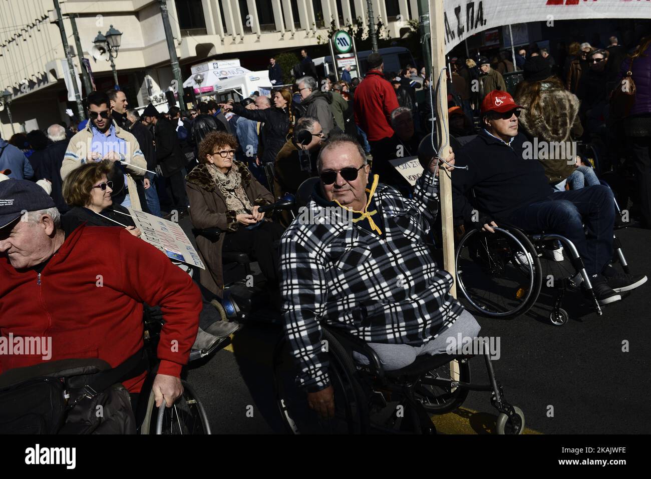 People with disabilities protest against austerity cuts in central Athens on December 2, 2016. A demonstration was held in Athens against austerity policies into welfare and disability benefits ahead of the international day of persons with disability. (Photo by Gerasimos Koilakos/NurPhoto) *** Please Use Credit from Credit Field *** Stock Photo