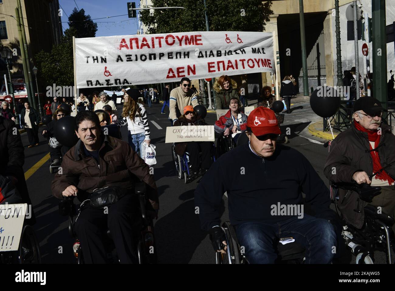 People with disabilities protest against austerity cuts in central Athens on December 2, 2016. A demonstration was held in Athens against austerity policies into welfare and disability benefits ahead of the international day of persons with disability. (Photo by Gerasimos Koilakos/NurPhoto) *** Please Use Credit from Credit Field *** Stock Photo