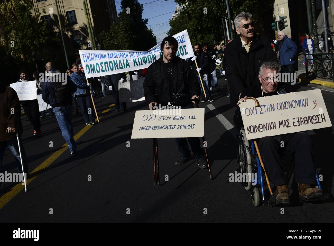 People with disabilities protest against austerity cuts in central Athens on December 2, 2016. A demonstration was held in Athens against austerity policies into welfare and disability benefits ahead of the international day of persons with disability. (Photo by Gerasimos Koilakos/NurPhoto) *** Please Use Credit from Credit Field *** Stock Photo