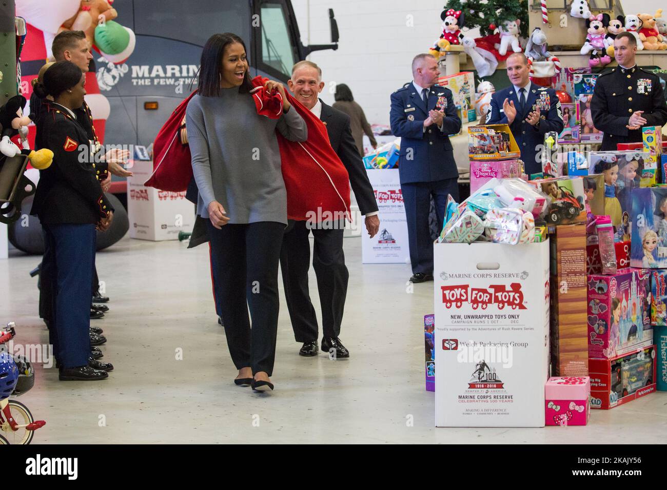 On Wednesday, Dec. 7 at Joint Base Anacostia-Bolling, First Lady Michelle Obama, followed by Lieutenant General H.P. (Pete) Osman, United States Marine Corps, Deputy Commandant for Manpower and Reserve, and some U.S. Marines, entered the room with bags of toys to sort for the Marine Corps ReserveÂ’s Â“Toys for TotsÂ” program. This was the eighth year Mrs. Obama has participated in the program, sorting toys for under-privileged children across the country. (Photo by Cheriss May/NurPhoto) *** Please Use Credit from Credit Field *** Stock Photo