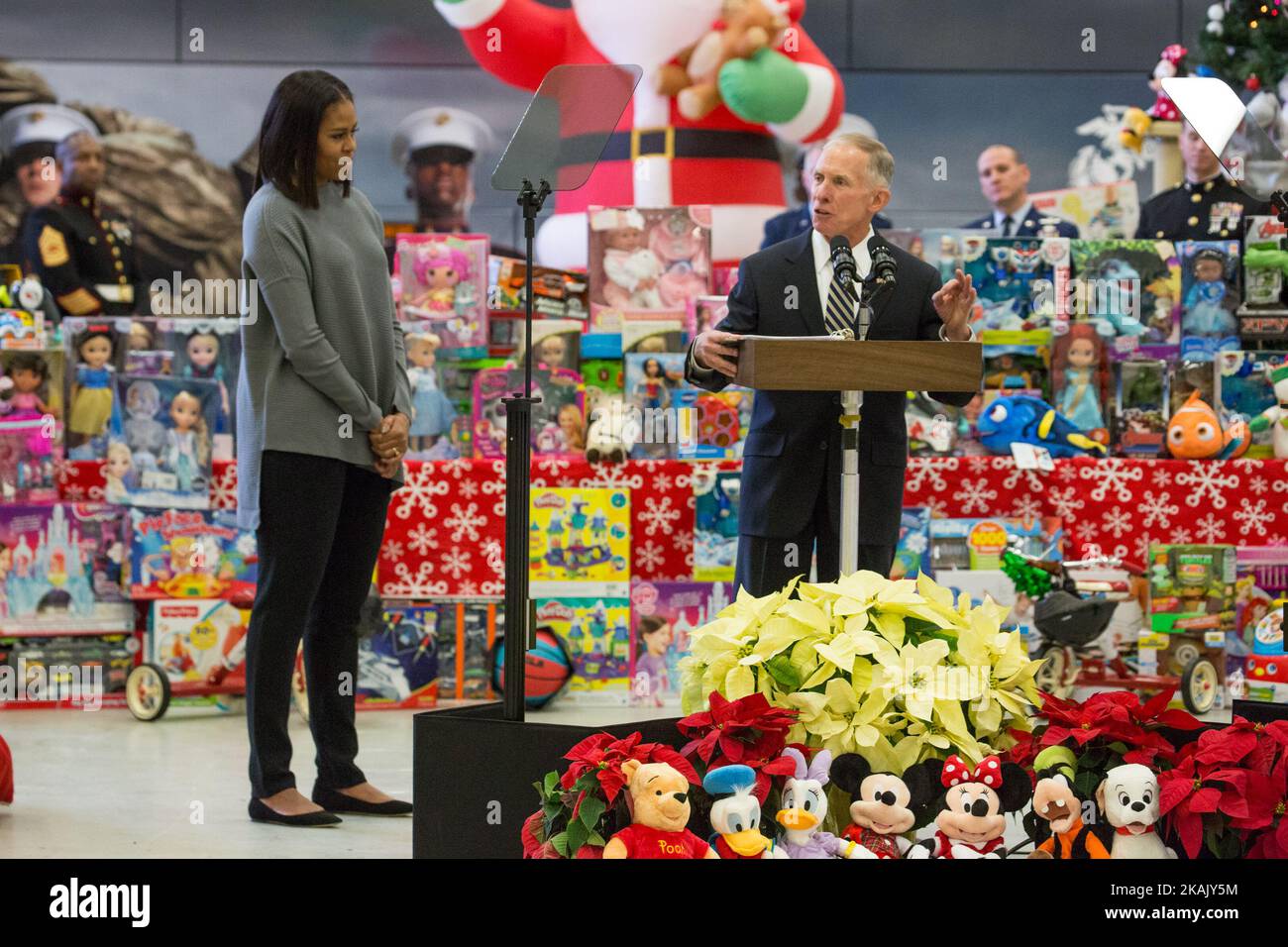 On Wednesday, Dec. 7 at Joint Base Anacostia-Bolling, Lieutenant General H.P. (Pete) Osman, United States Marine Corps, Deputy Commandant for Manpower and Reserve, speaks to military familes, as he introduces First Lady Michelle Obama (left), before sorting toys for the Marine Corps ReserveÂ’s Â“Toys for TotsÂ” program. This was the eighth year Mrs. Obama has participated in the program, sorting toys for under-privileged children across the country. (Photo by Cheriss May/NurPhoto) *** Please Use Credit from Credit Field *** Stock Photo