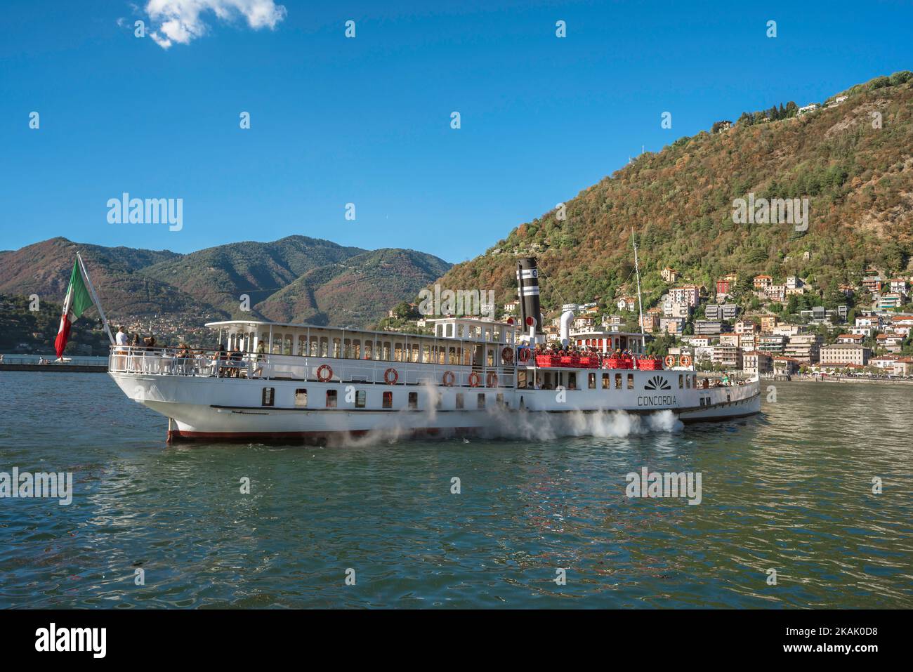 Steamboat Lake Como, view in summer of the steamboat ferry Concordia departing Como city harbour in Lake Como, Lombardy, Italy Stock Photo