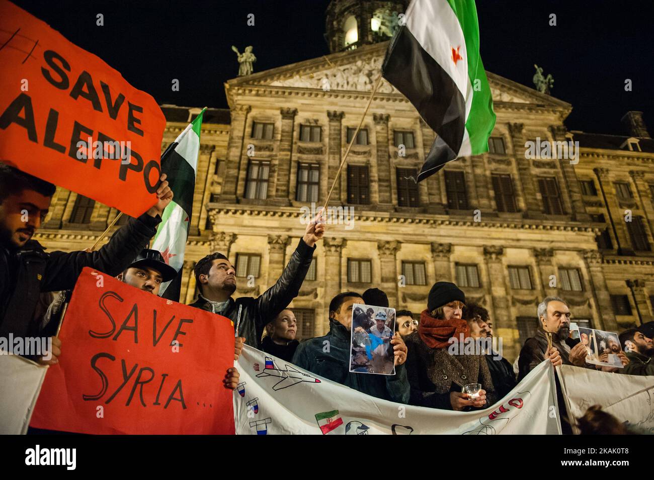 The recent news are reporting the dead of at least 82 civilians killed by Syrian soldiers and allied Shiite militias from Iraq and backed by Iran, according to U.N. reports. So, on the evening of December 14, people in The Netherlands has been called to show their support and solidarity with the people of Aleppo peacefully, in one of the most emblematics places in Amsterdam, The 'Dam Square' to light candles for the victims. (Photo by Romy Arroyo Fernandez/NurPhoto) *** Please Use Credit from Credit Field *** Stock Photo