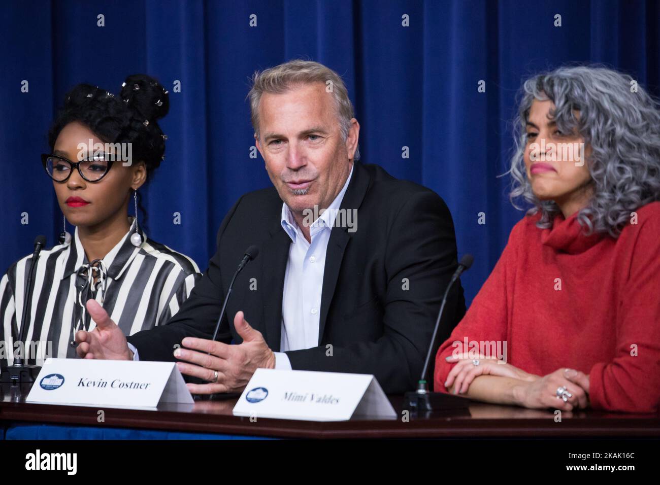 On Thursday, December 15th, in the South Court Auditorium of the Eisenhower Executive Office Building of the White House, (l-r), 'Hidden Figures' actress Janelle Monae,, actor Kevin Costner, and producer Mimi ValdÃ©s, speak on a panel about the film, a biographical film that tells the story of NASA pioneers Katherine Johnson, Dorothy Vaughn, and Mary Jackson, African-American women whose work enabled the first launches of Americans into space. (Photo by Cheriss May/NurPhoto) *** Please Use Credit from Credit Field *** Stock Photo