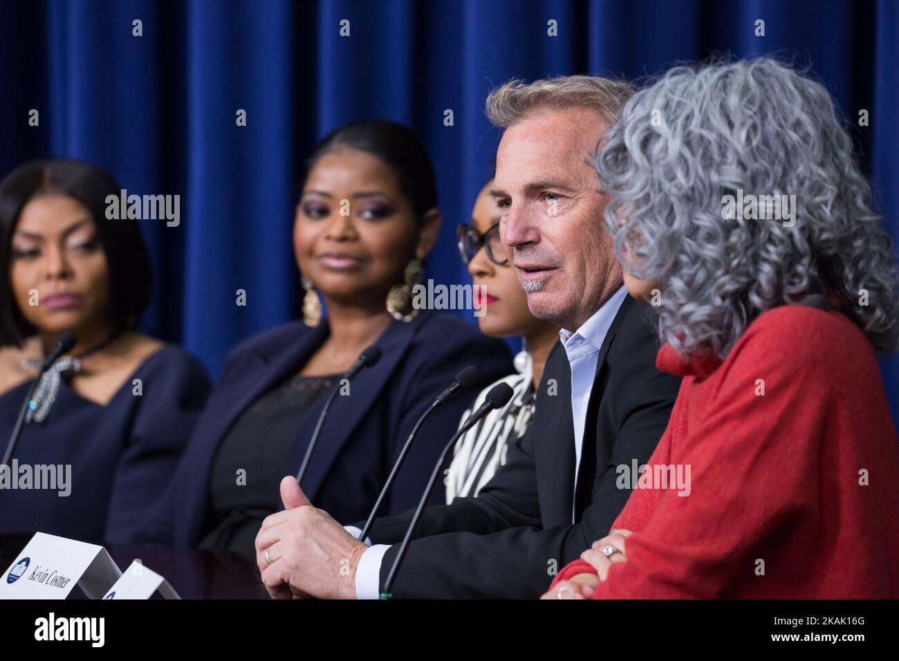 On Thursday, December 15th, in the South Court Auditorium of the Eisenhower Executive Office Building of the White House, (l-r) 'Hidden Figures' actress Taraji P. Henson, actress Octavia Spencer, actress Janelle Monae, actor Kevin Costner, and producer Mimi ValdÃ©s, speak on a panel about the film, Â“Hidden FiguresÂ”, a biographical film that tells the story of NASA pioneers Katherine Johnson, Dorothy Vaughn, and Mary Jackson, African-American women whose work enabled the first launches of Americans into space. (Photo by Cheriss May/NurPhoto) *** Please Use Credit from Credit Field *** Stock Photo