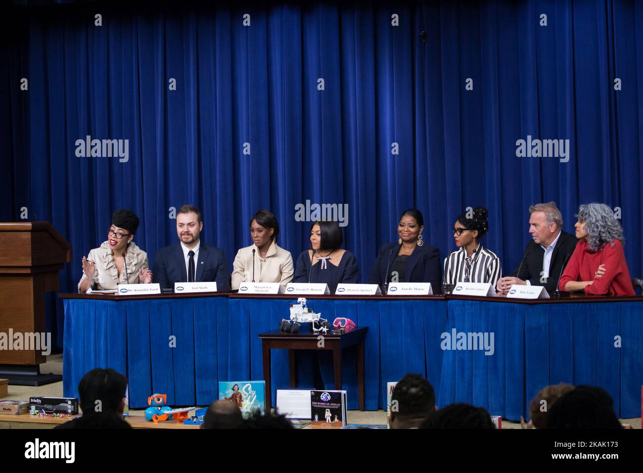 On Thursday, December 15th, in the South Court Auditorium of the Eisenhower Executive Office Building of the White House, (l-r) Dr. Knatokie Ford, Senior Policy Advisor, White House Office of Science and Technology Policy, 'Hidden Figures' director Ted Melfi, author Margot Lee Shetterly, actress Taraji P. Henson, actress Octavia Spencer, actress Janelle Monae, actor Kevin Costner, and producer Mimi ValdÃ©s, speak on a panel about the film, Â“Hidden FiguresÂ”, a biographical film that tells the story of NASA pioneers Katherine Johnson, Dorothy Vaughn, and Mary Jackson, African-American women wh Stock Photo