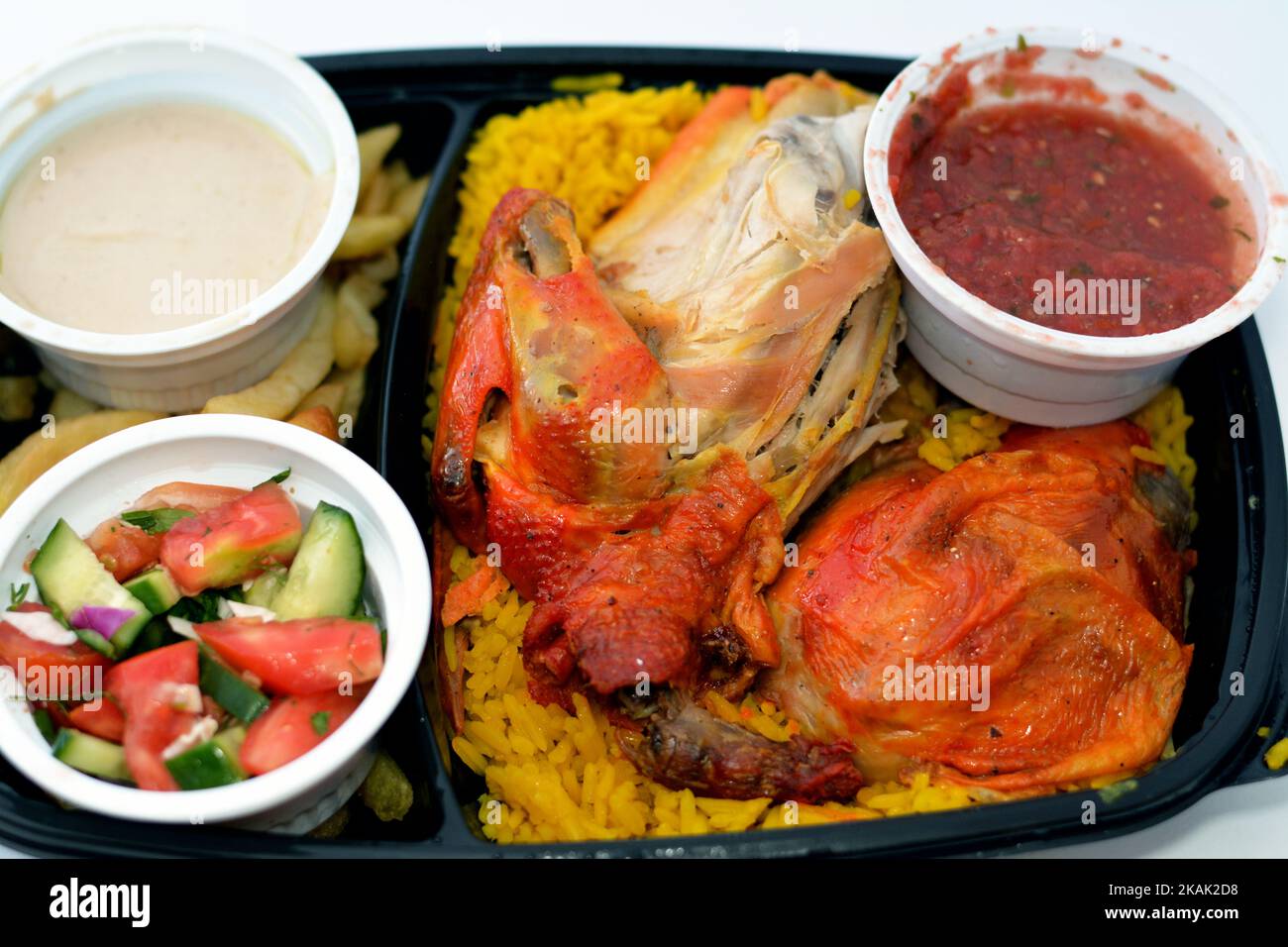 Chicken mandi kabsa with long basmati rice and french fries, served