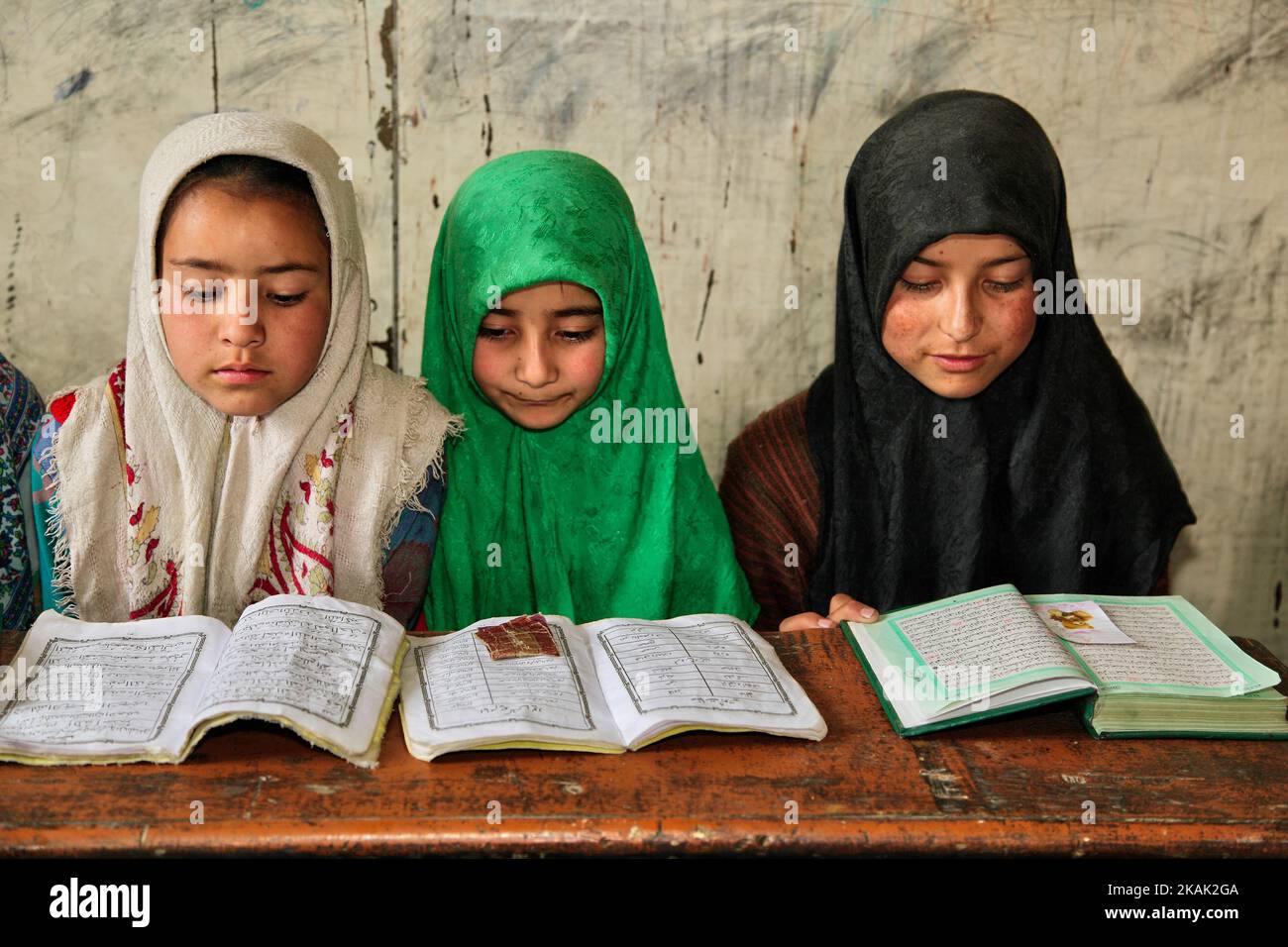 Muslim children study the Quran at a Madrassa (Islamic religious school) in a small village near the town of Kargil in Ladakh, Jammu and Kashmir, India on June 25, 2014. (This image has a signed model release). (Photo by Creative Touch Imaging Ltd./NurPhoto) *** Please Use Credit from Credit Field *** Stock Photo