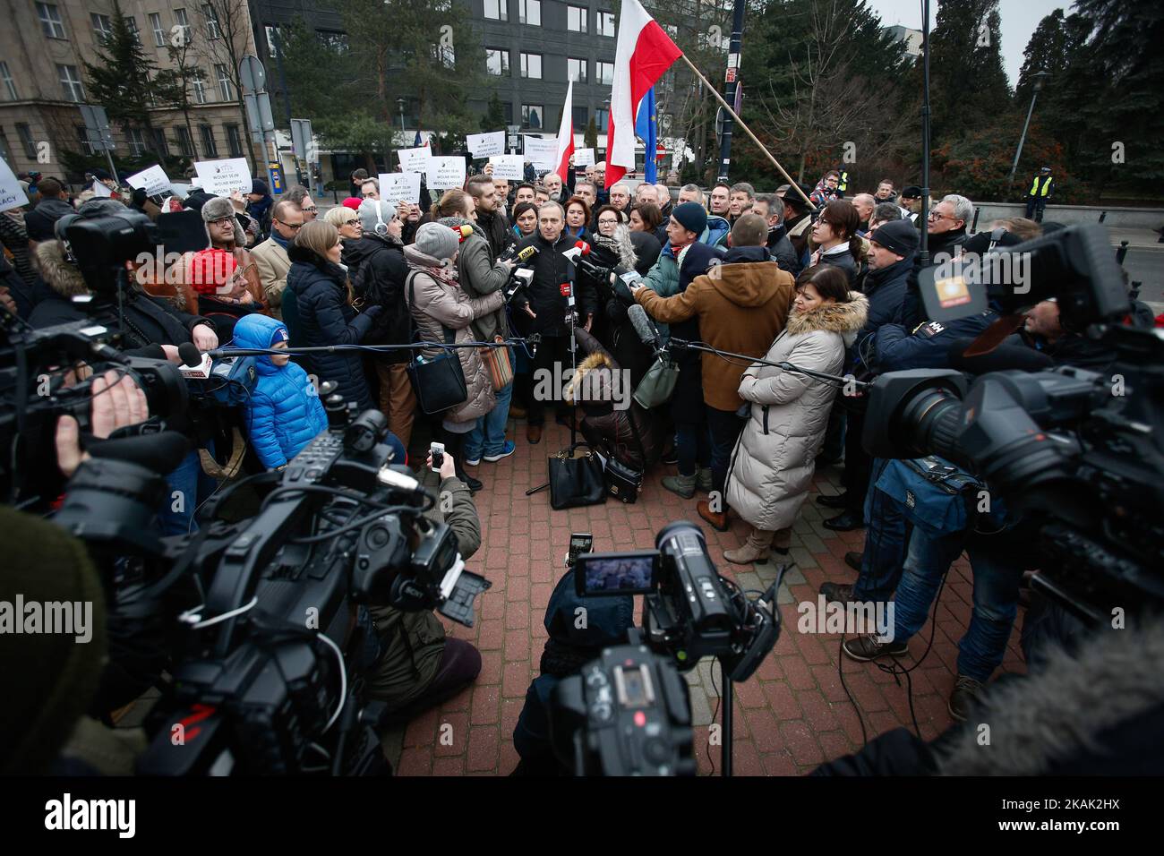 Members of the oppostion hold a short press conference outside parliament over the situation inside in Bydgoszcz, Poland on December 17, 2016. People stand outside the entrance of the Sejm, the Polish parliament after liberal lawmakers blocked a conservative budget proposal which included limiting access to free information and further limits on media access to politicians. The current events amount to the most serious political crisis the country has seen in its 27 years as a democratic republic. (Photo by Jaap Arriens/NurPhoto) *** Please Use Credit from Credit Field *** Stock Photo