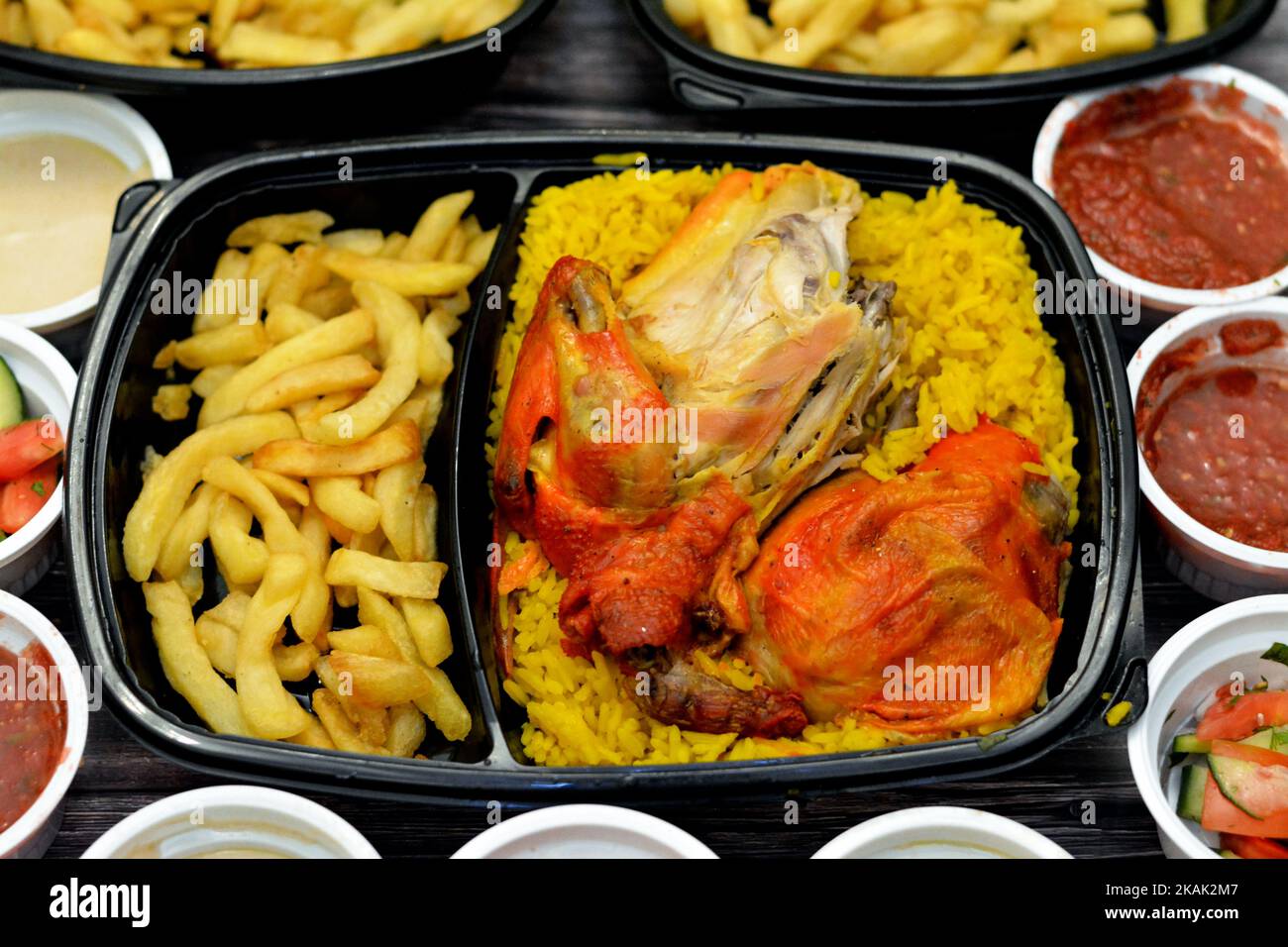 Chicken mandi kabsa with long basmati rice and french fries, served
