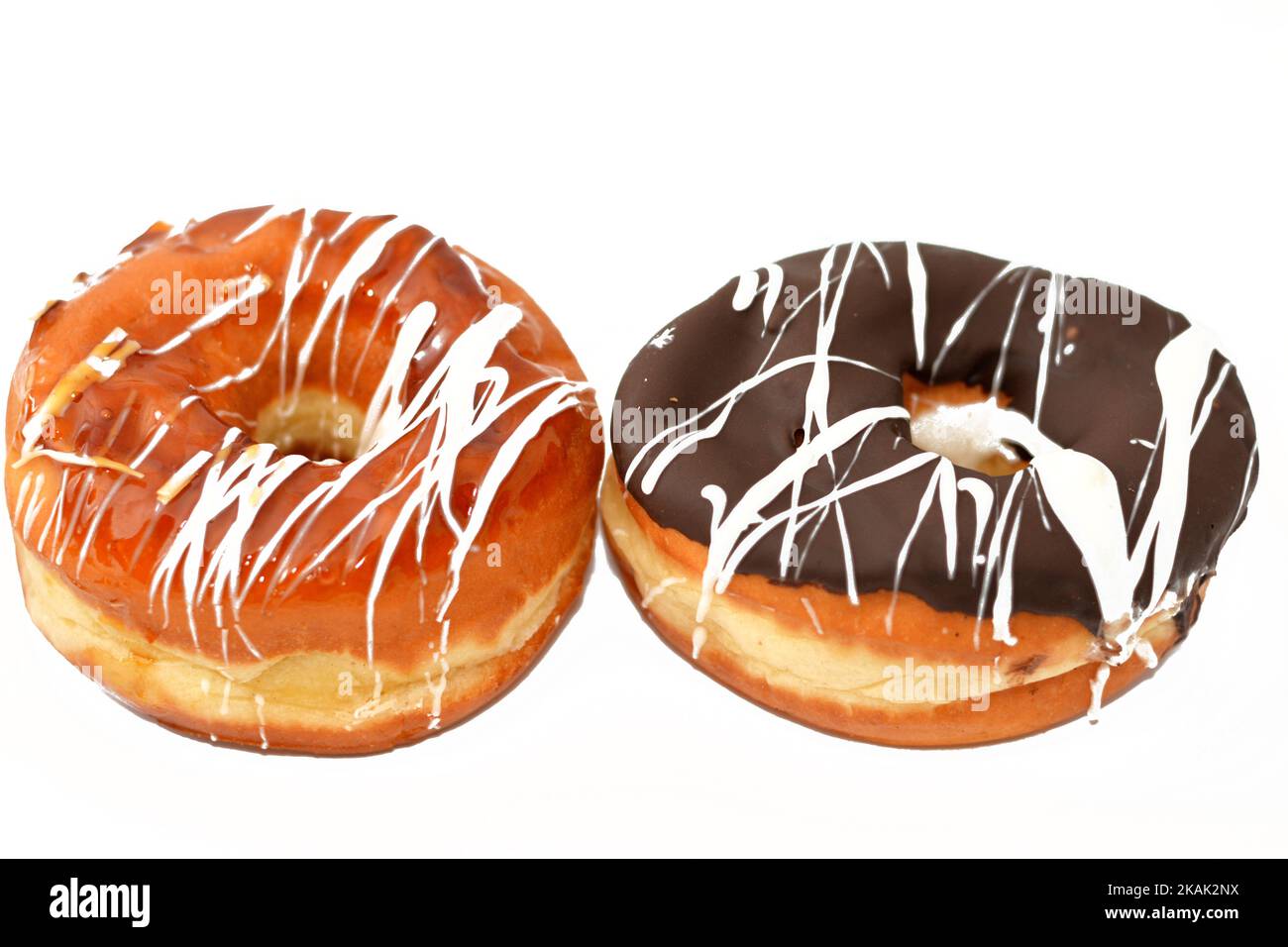 Ring donuts with brown, caramel and white chocolate sauce, A glazed