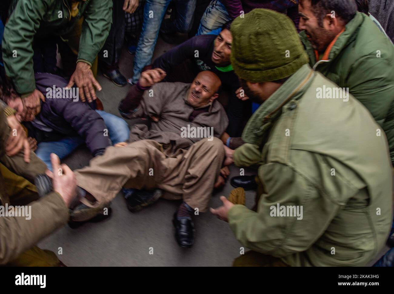 Indian government forces drag and detain, Engineer Sheikh Abdul Rashid an Indian Politician and Member of Legislative Assembly (MLA) and patron of Awami Ithaad Party, a pro-Indian political party, during a protest against India's proposal to allow refugees from the west of Pakistan to settle in the disputed region of Jammu and Kashmir on December 22, 2016 in Srinagar, the summer capital of Indian administered Kashmir, India. (Photo by Yawar Nazir/NurPhoto) *** Please Use Credit from Credit Field *** Stock Photo