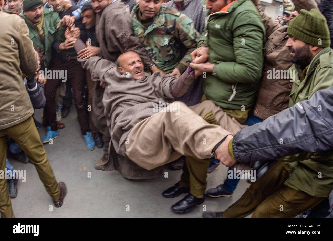Indian government forces drag and detain, Engineer Sheikh Abdul Rashid an Indian Politician and Member of Legislative Assembly (MLA) and patron of Awami Ithaad Party, a pro-Indian political party, during a protest against India's proposal to allow refugees from the west of Pakistan to settle in the disputed region of Jammu and Kashmir on December 22, 2016 in Srinagar, the summer capital of Indian administered Kashmir, India. (Photo by Yawar Nazir/NurPhoto) *** Please Use Credit from Credit Field *** Stock Photo