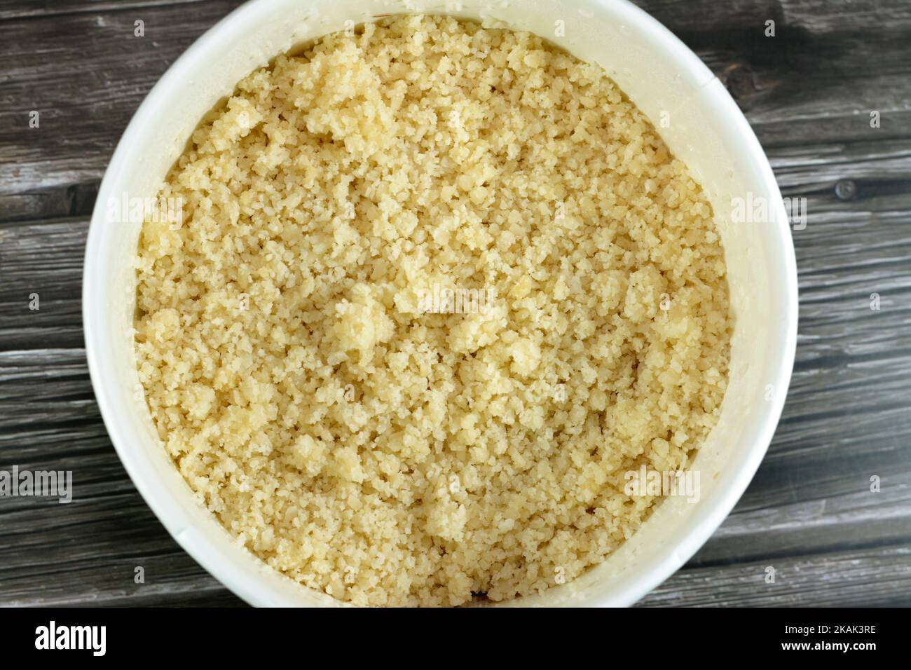 Arabian Cuisine dish of small steamed granules of rolled durum wheat semolina called Koskosi, couscous, kusksi or kseksu, popular in Morocco, Algeria, Stock Photo