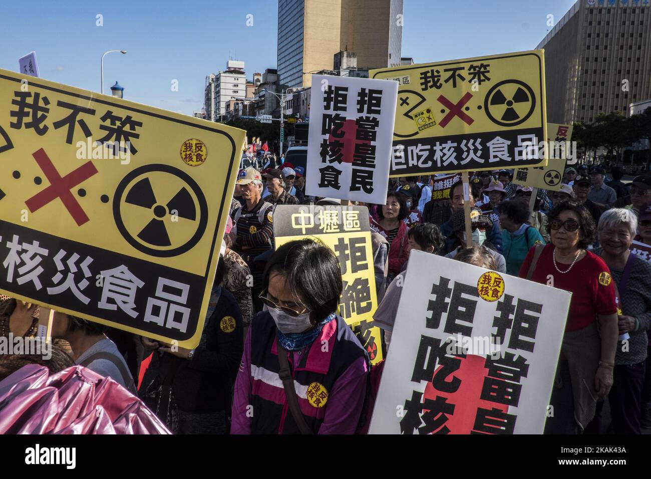 Taiwanese people meet at Chiang Kai-shek Memorial Hall in Taipei, Taiwan, on 25 December 2016 to march to the Ministry of Finance building in order to protest against the import of Food Product coming from the Nuclear contaminated region of Fukushima, Japan. Taiwan banned food imports from the Japanese prefectures of Fukushima, Ibaraki, Tochigi, Gunma and Chiba in the wake of the Fukushima Daiichi nuclear power plant meltdown following a massive earthquake and tsunami on March 11, 2011. But, The Democratic Progressive Party government is now considering lifting the ban on food from all the pre Stock Photo