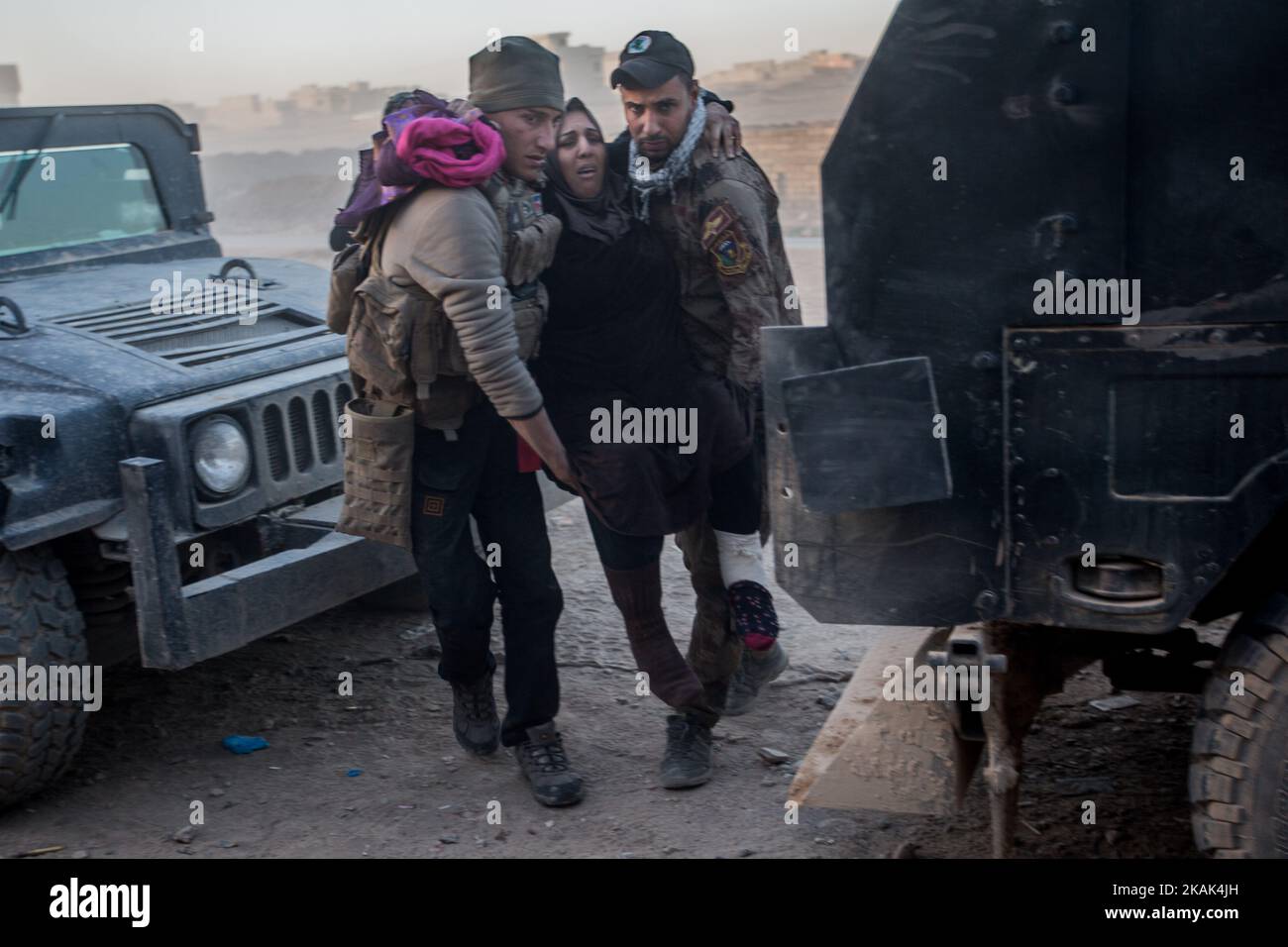(11/25/2016) A woman is carried in to a field hospital in Mosul, Iraq, located in the eastern district of Hay Samah. She was injured in an attack by an ISIS suicide bomber, who blows up a car bomb in front of her house. (Photo by Sebastian Backhaus/NurPhoto) *** Please Use Credit from Credit Field *** Stock Photo