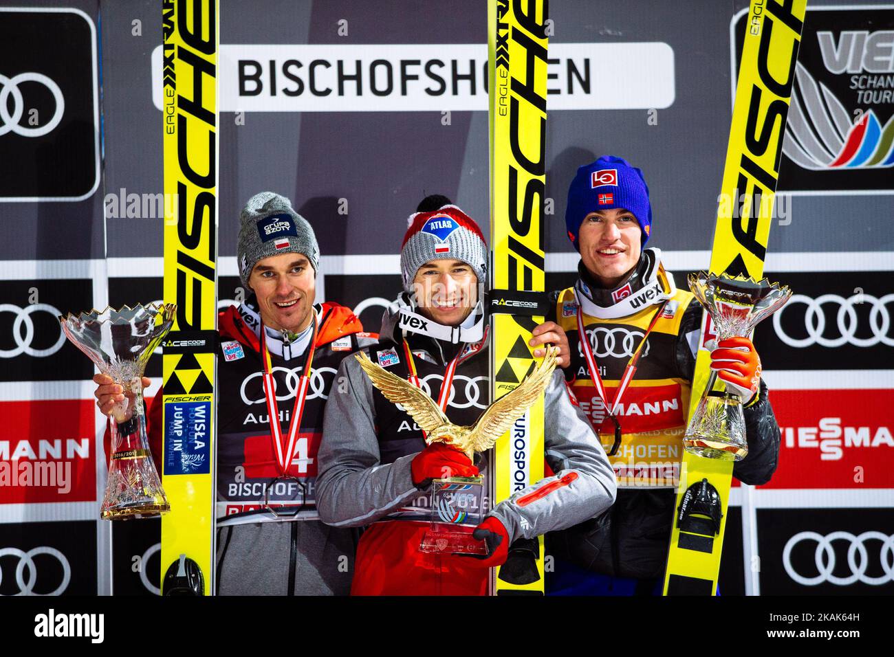 Kamil Stoch (C) of Poland celebrates winning the 65th Four Hills Tournament ski jumping event with Daniel Andre Tande (2nd Place, R) of Norway and Piotr Zyla (3rd Place, L) of Poland on Day 2 of the 65th Four Hills Tournament ski jumping event at Paul-Ausserleitner-Schanze on January 6, 2017 in Bischofshofen, Austria. (Photo by Damjan Zibert/NurPhoto) *** Please Use Credit from Credit Field *** Stock Photo