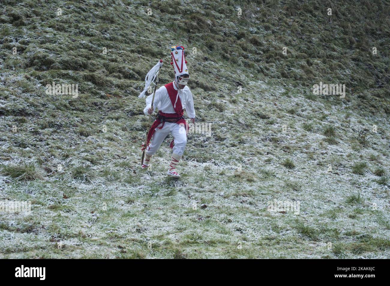 A white dancer descends by a hillside jumping during the first carnival of the year in Vijanera festival on January 8, 2017 in Silio, Cantabria province, Spain. (Photo by Joaquin Gomez Sastre/NurPhoto) *** Please Use Credit from Credit Field *** Stock Photo