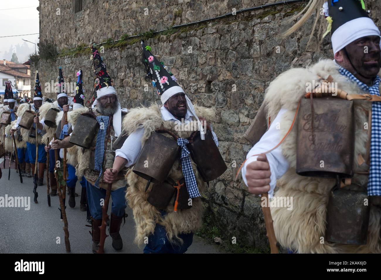 The zarramacos cross the streets of the town of Silio in the party of the Vijanera festival on January 8, 2017 in Silio, Cantabria province, Spain, considered the first winter carnival in Europe as they ring their bells to celebrate the capture of the bear that symbolizes evil. (Photo by Joaquin Gomez Sastre/NurPhoto) *** Please Use Credit from Credit Field *** Stock Photo