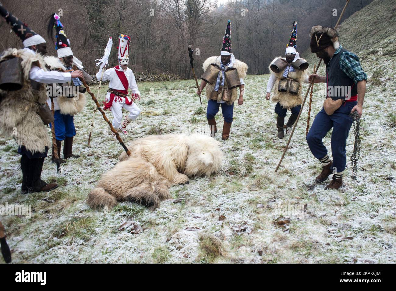 During their tour the zarramacos beat and throw to the ground to the bear before killing during Vijanera festival on January 8, 2017 in Silio, Cantabria province, Spain that is considered the first winter carnival of Spain. (Photo by Joaquin Gomez Sastre/NurPhoto) *** Please Use Credit from Credit Field *** Stock Photo