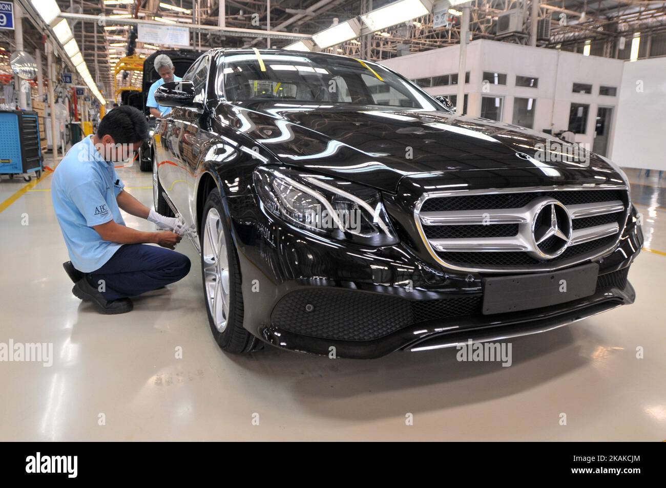 Workers assembling car type sedan E-Class at Mercedes-Benz plant in Wanaherang district, Bogor, West Java, on January 24, 2017. Mercedes-Benz Indonesia started the inaugural assembly in Indonesia for the series E-Class with two variants of the E 250 and E 300 Avantgarde AMG with high technology to increase sales in Asia, especially in Indonesia. Dasril Roszandi (Photo by Dasril Roszandi/NurPhoto) *** Please Use Credit from Credit Field *** Stock Photo