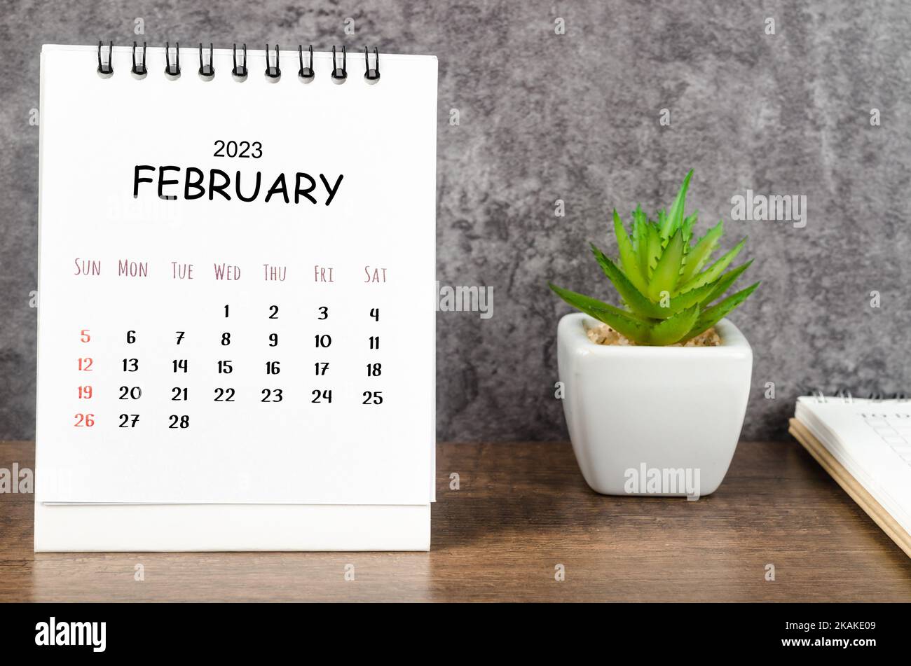 February 2023 Monthly desk calendar for 2023 with diary on wooden table ...
