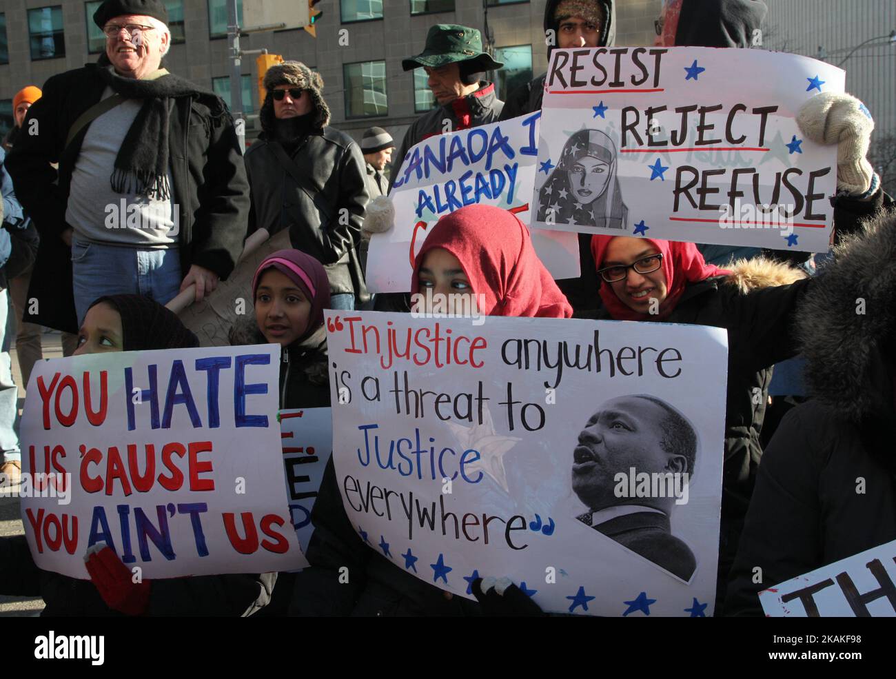 Muslim Canadians participate in a massive protest against President Trump's travel ban outside of the U.S. Consulate in downtown Toronto, Ontario, Canada, on January 30, 2017. Canadians joined countries around the world in protesting against American President Donald Trump's executive order, banning citizens of seven majority Muslim countries (Iran, Iraq, Sudan, Somalia, Syria, Yemen and Libya) from entering the United States for the next three months and banning Syrian refugees from indefinitely entering America. (Photo by Creative Touch Imaging Ltd./NurPhoto) *** Please Use Credit from Credi Stock Photo