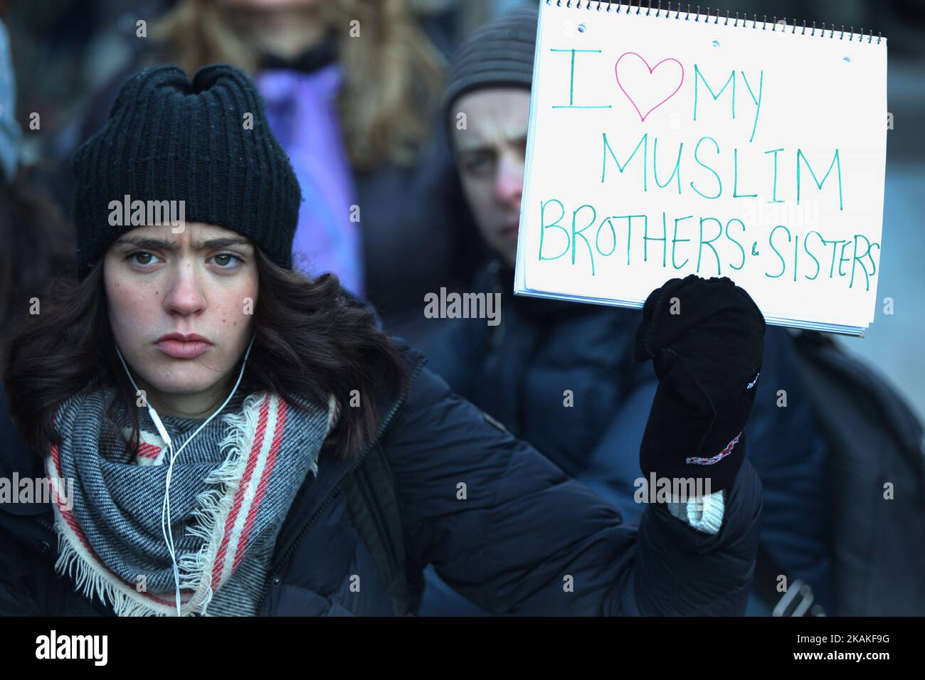 Woman holding a sign saying 'I love my Muslim brothers and sisters' during a massive protest against President Trump's travel ban outside of the U.S. Consulate in downtown Toronto, Ontario, Canada, on January 30, 2017. Canadians joined countries around the world in protesting against American President Donald Trump's executive order, banning citizens of seven majority Muslim countries (Iran, Iraq, Sudan, Somalia, Syria, Yemen and Libya) from entering the United States for the next three months and banning Syrian refugees from indefinitely entering America. (Photo by Creative Touch Imaging Ltd. Stock Photo