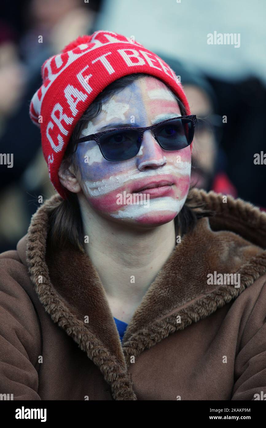 Protestor with their face pained with the American flag during a massive protest against President Trump's travel ban outside of the U.S. Consulate in downtown Toronto, Ontario, Canada, on January 30, 2017. Canadians joined countries around the world in protesting against American President Donald Trump's executive order, banning citizens of seven majority Muslim countries (Iran, Iraq, Sudan, Somalia, Syria, Yemen and Libya) from entering the United States for the next three months and banning Syrian refugees from indefinitely entering America. (Photo by Creative Touch Imaging Ltd./NurPhoto) * Stock Photo