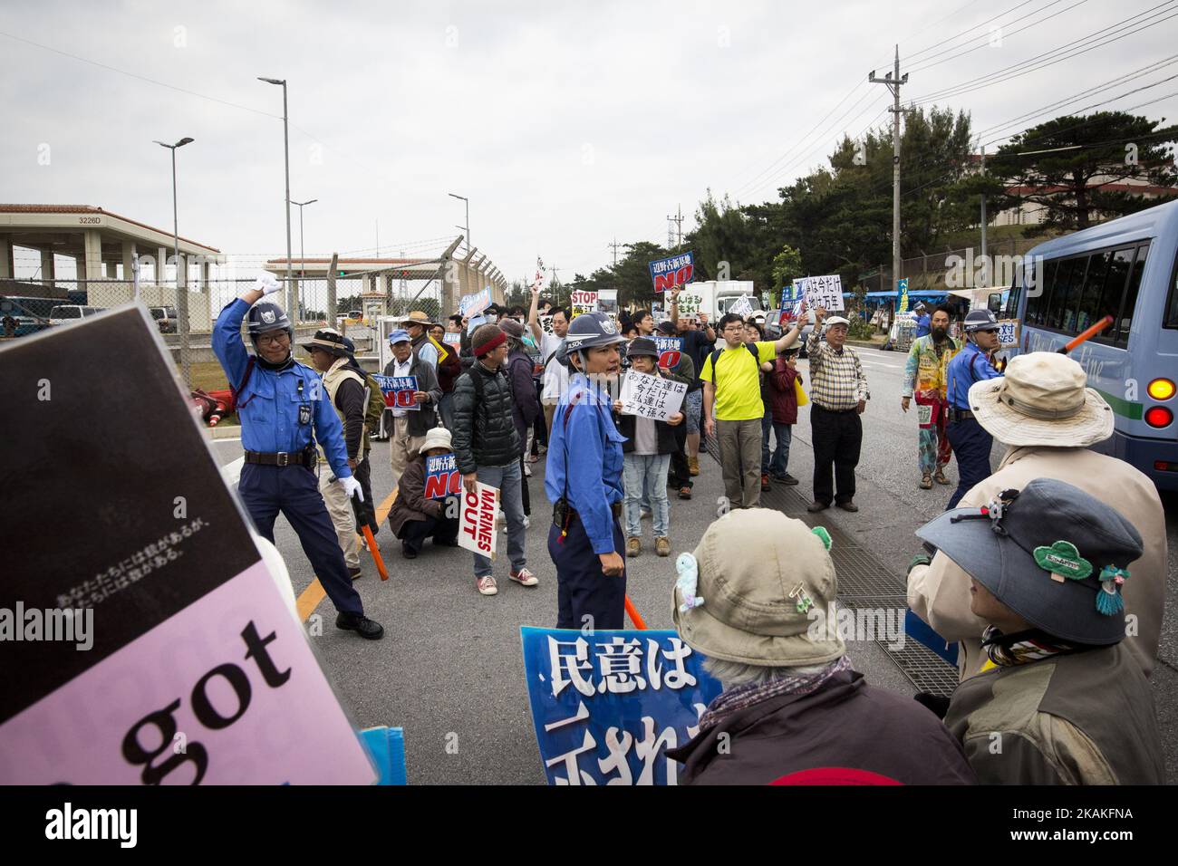 Anti U.S. Base protesters with placards stage a rally outside of the U.S Marine Camp Schwab gate to protest against the construction of the new U.S Marine Airbase in Nago, Okinawa, Japan on Wednesday, February 1, 2017. Okinawa Gov. Takeshi Onaga arrived in the United States on Tuesday, aiming to convey to President Donald TrumpÂ’s administration local opposition to a plan to relocate a U.S. airbase within the southern island prefecture. (Photo by Richard Atrero de Guzman/NurPhoto) *** Please Use Credit from Credit Field *** Stock Photo
