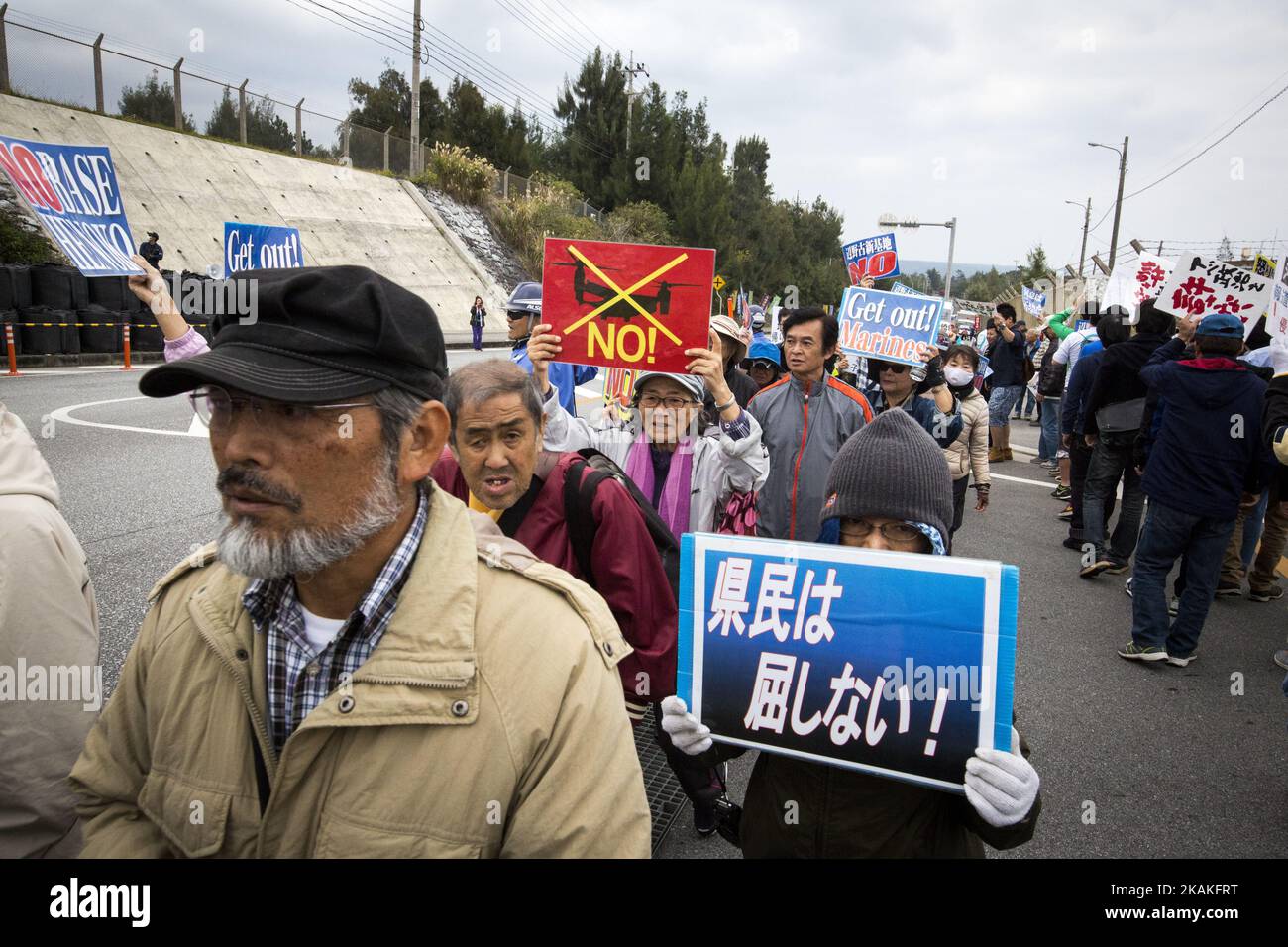Anti U.S. Base protesters with placards stage a rally outside of the U.S Marine Camp Schwab gate to protest against the construction of the new U.S Marine Airbase in Nago, Okinawa, Japan on Wednesday, February 1, 2017. Okinawa Gov. Takeshi Onaga arrived in the United States on Tuesday, aiming to convey to President Donald TrumpÂ’s administration local opposition to a plan to relocate a U.S. airbase within the southern island prefecture. (Photo by Richard Atrero de Guzman/NurPhoto) *** Please Use Credit from Credit Field *** Stock Photo