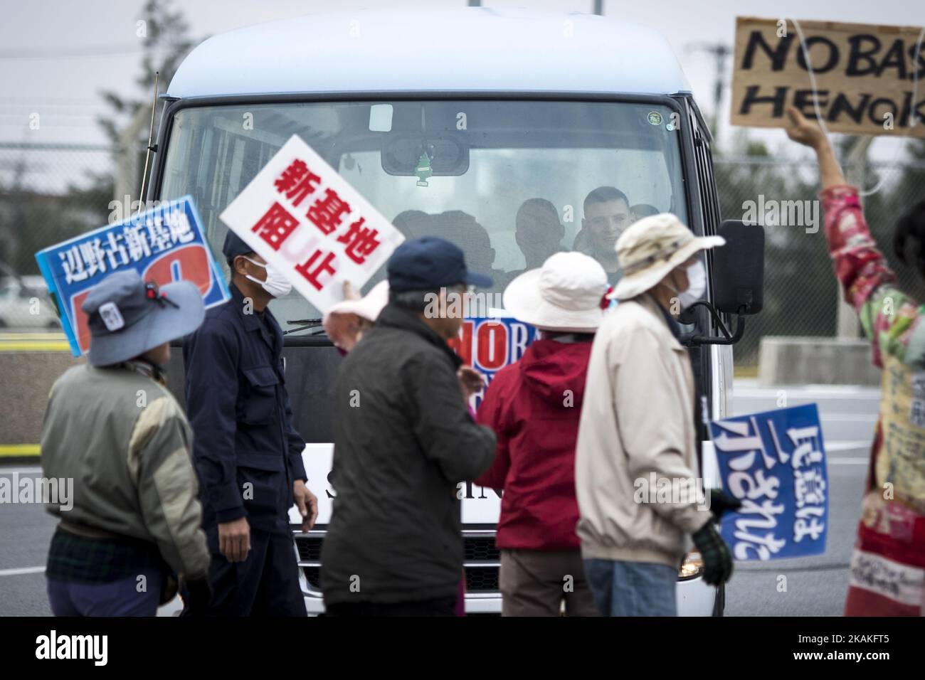 Anti U.S. Base protesters shout with placards and block the cars of US marines from getting out of the U.S Marine Camp Schwab, protesting against the construction of the new U.S Marine Airbase in Nago, Okinawa, Japan on Wednesday, February 1, 2017. Okinawa Gov. Takeshi Onaga arrived in the United States on Tuesday, aiming to convey to President Donald TrumpÂ’s administration local opposition to a plan to relocate a U.S. airbase within the southern island prefecture. (Photo by Richard Atrero de Guzman/NurPhoto) *** Please Use Credit from Credit Field *** Stock Photo