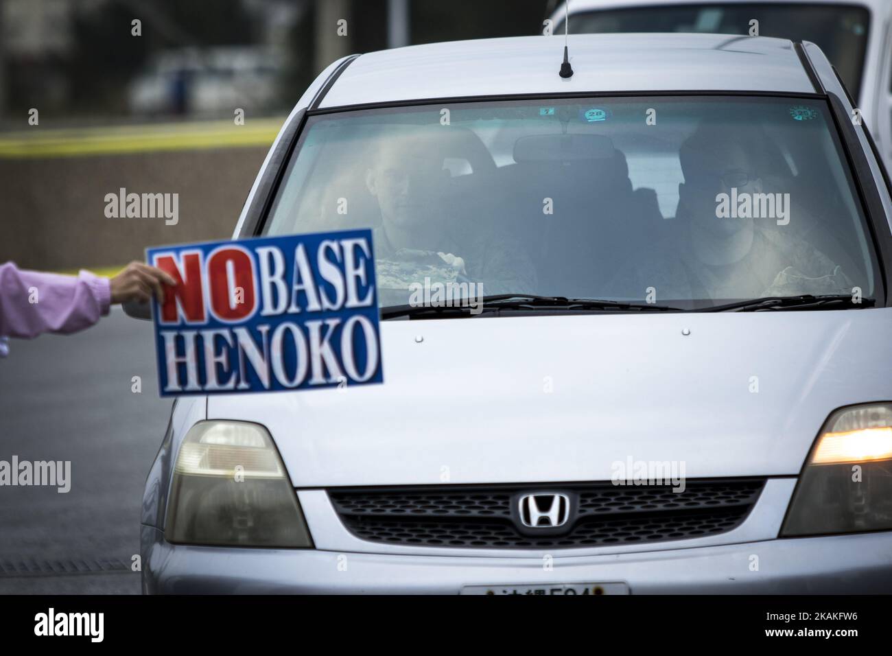 Anti U.S. Base protesters shout with placards and block the cars of US marines from getting out of the U.S Marine Camp Schwab, protesting against the construction of the new U.S Marine Airbase in Nago, Okinawa, Japan on Wednesday, February 1, 2017. Okinawa Gov. Takeshi Onaga arrived in the United States on Tuesday, aiming to convey to President Donald TrumpÂ’s administration local opposition to a plan to relocate a U.S. airbase within the southern island prefecture. (Photo by Richard Atrero de Guzman/NurPhoto) *** Please Use Credit from Credit Field *** Stock Photo