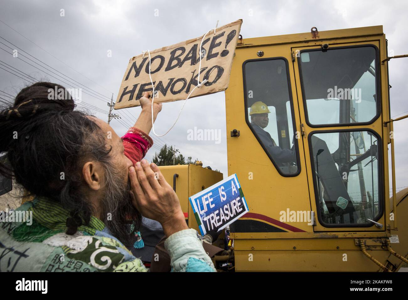 Anti U.S. Base protesters shout with placards and block the construction trucks from getting inside of the U.S Marine Camp Schwab, protesting against the construction of the new U.S Marine Airbase in Nago, Okinawa, Japan on Wednesday, February 1, 2017. Okinawa Gov. Takeshi Onaga arrived in the United States on Tuesday, aiming to convey to President Donald TrumpÂ’s administration local opposition to a plan to relocate a U.S. airbase within the southern island prefecture. (Photo by Richard Atrero de Guzman/NurPhoto) *** Please Use Credit from Credit Field *** Stock Photo