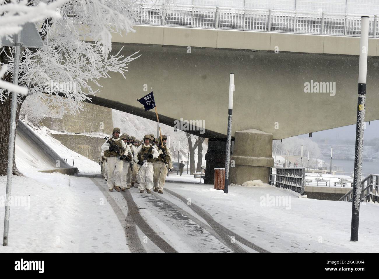 US Army soldiers and Estonian Army scouts marching on the river