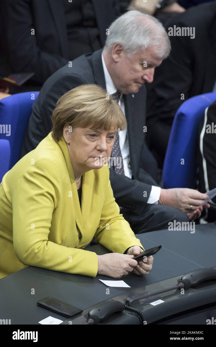German Chancellor Angela Merkel (down, L) and President of Bavaria Horst Seehofer (up, R) are seen prior to the vote for the presidential election by the Bundesversammlung (Federal Assembly) at the Reichstag in Berlin, Germany on February 12, 2017. Presidential candidate Frank-Walter Steinmeier, 61, is certain to be voted as new President being the official candidate of the government parties CDU/CSU and SPD and supported from FDP and Green party, against poverty researcher Christoph Butterwegge, nominated by the left party Die Linke and Albrecht Glaser, nominated by the far right party AfD (A Stock Photo