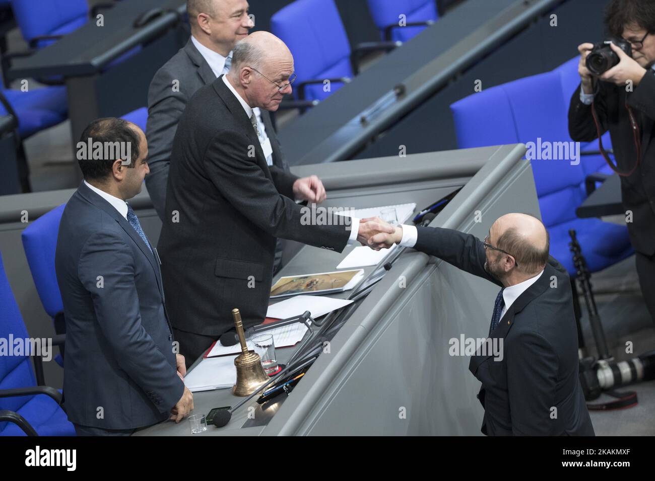 President of the Bundestag Norbert Lammert (L) shake hands with SPD chancellor candidate and former President of the European Parliament Martin Schulz at the end of the presidential election by the Bundesversammlung (Federal Assembly) at the Reichstag in Berlin, Germany on February 12, 2017. Steinmeier, 61, obtained 931 votes out of 1,260 being the official candidate of the government parties CDU/CSU and SPD and supported from FDP and Green party, against poverty researcher Christoph Butterwegge, nominated by the left party Die Linke and Albrecht Glaser, nominated by the far right party AfD (A Stock Photo