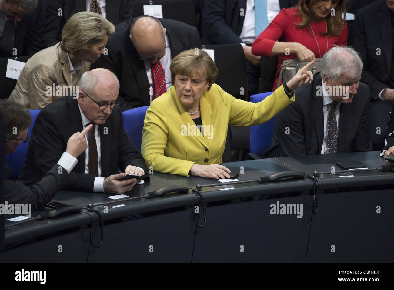 German Chancellor Angela Merkel (C), President of Bavaria Horst Seehofer (R) and chairman of the CDU/CSU Bundestag faction Volker Kauder (L) chat during the vote for the presidential election by the Bundesversammlung (Federal Assembly) at the Reichstag in Berlin, Germany on February 12, 2017. Presidential candidate Frank-Walter Steinmeier, 61, is certain to be voted as new President being the official candidate of the government parties CDU/CSU and SPD and supported from FDP and Green party, against poverty researcher Christoph Butterwegge, nominated by the left party Die Linke and Albrecht Gl Stock Photo
